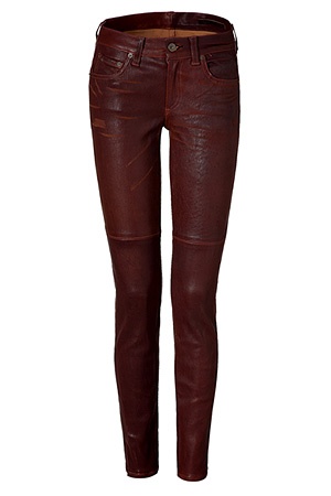 a pair of slimfitting, red leather trousers are displayed against a white background.