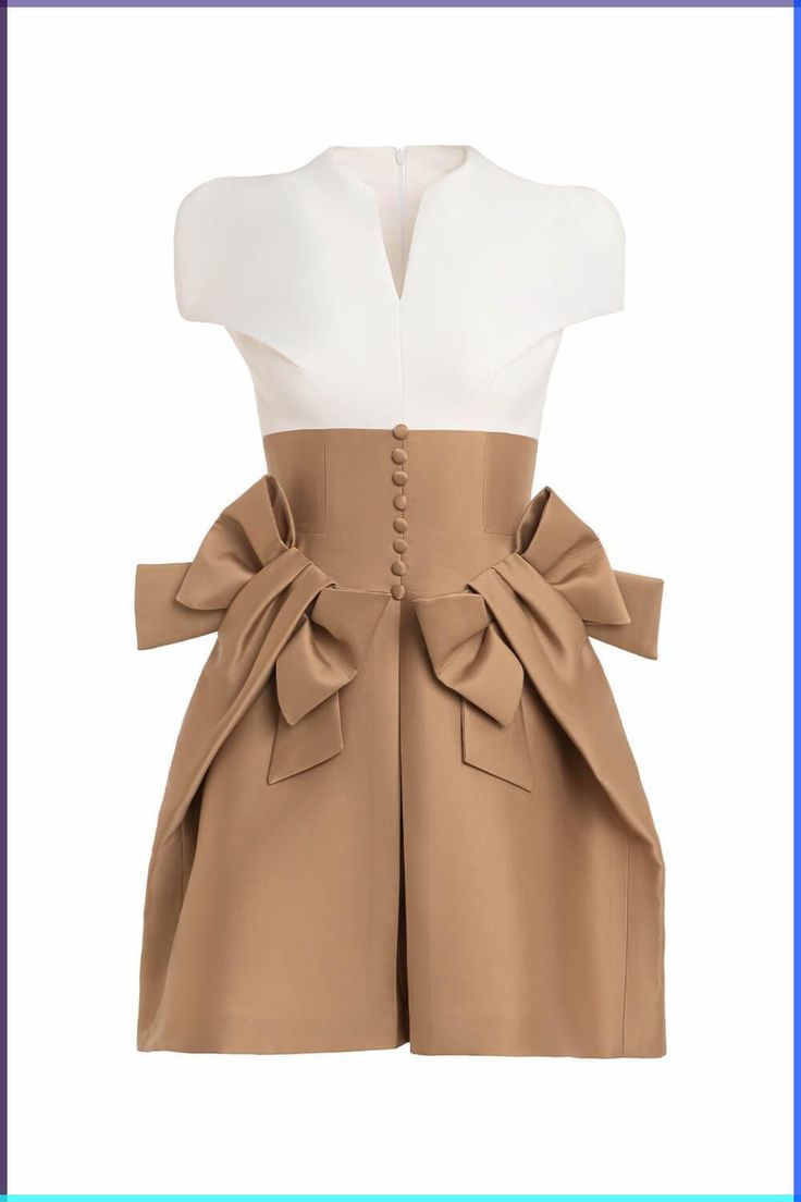 the image shows a dress with a white bodice, a brown skirt, and large decorative bows at the waist. the dress has short sleeves, and a row of buttons runs down the center of the brown waistband.