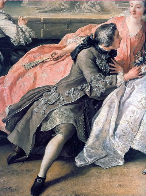 the image is a detail from a rococo painting, likely by watteau or a similar artist. it features a seated man in a gray coat with lace embellishments, wearing breeches and black shoes with buckles. he is turned towards a woman in a pink dress and white underskirt. the woman holds flowers and sits adjacent to the man. an open fan is held by another figure in the background. the scene depicts a moment of courtship or flirtation in an 18thcentury setting, characterized by formal attire and elegant gestures.