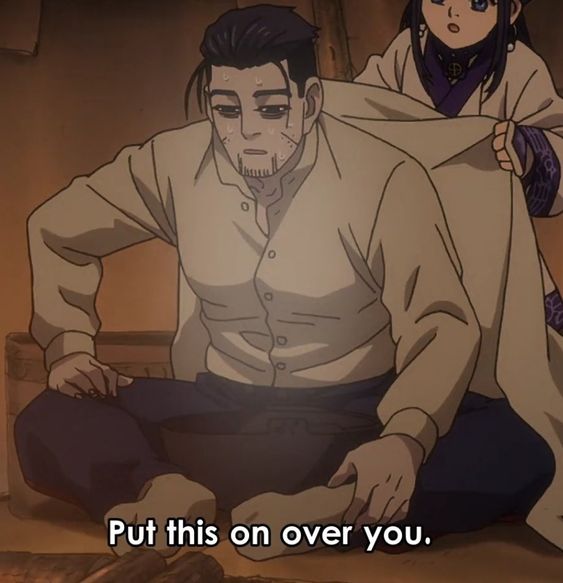 a screenshot from the anime demon slayer. a tiredlooking man sits on the floor while a woman drapes a blanket over his shoulders. the image's warm lighting and perspective create an intimate and caring atmosphere.