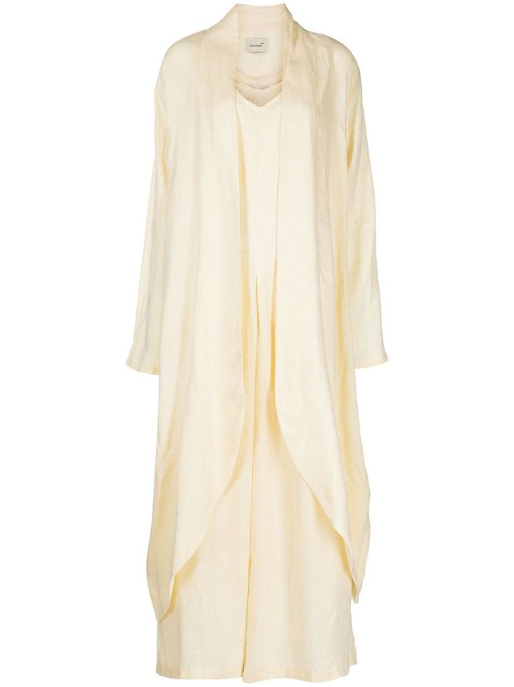 a women's white linen dress with long sleeves and a loosefitting silhouette. the dress features a draped design with a flowing, elegant look. it's a versatile piece that can be dressed up or down for any occasion.
