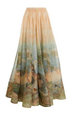 a light yellow long skirt with a delicate floral print. the skirt is made of a flowing chiffon fabric and is perfect for summer. the skirt is bohemian in style and would look great with a simple white top.