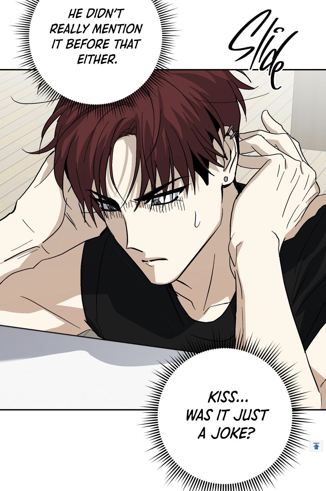 the image is a panel from a manhwa (korean comic) or webtoon. it features a closeup of a young man with dark red hair, styled with bangs partially covering his eyes. he has a worried, pensive expression, his hands touching his head.  the panel includes two dialogue bubbles; one reveals the character's internal thoughts reflecting on a conversation where something wasn't mentioned ("he didn't really mention it before that either."), and the other poses a question about a previous kiss ("kiss... was it just a joke?").  the overall style is cleanlined with a balance of black and white tones, typical of the medium. the background is minimal, focusing attention on the character's emotional state. the word "slide" is written stylistically in the upper right corner, possibly indicating a transition between panels or a narrative element.