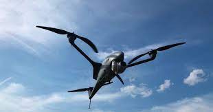 a drone is flying in the sky against a backdrop of white clouds. it has two main wings on either side of its body and two propellers on its tail. the drone is a modern piece of technology that is used for a variety of purposes, such as photography, surveillance, and transportation. it is a symbol of the future of aviation and the rapid advancement of technology.