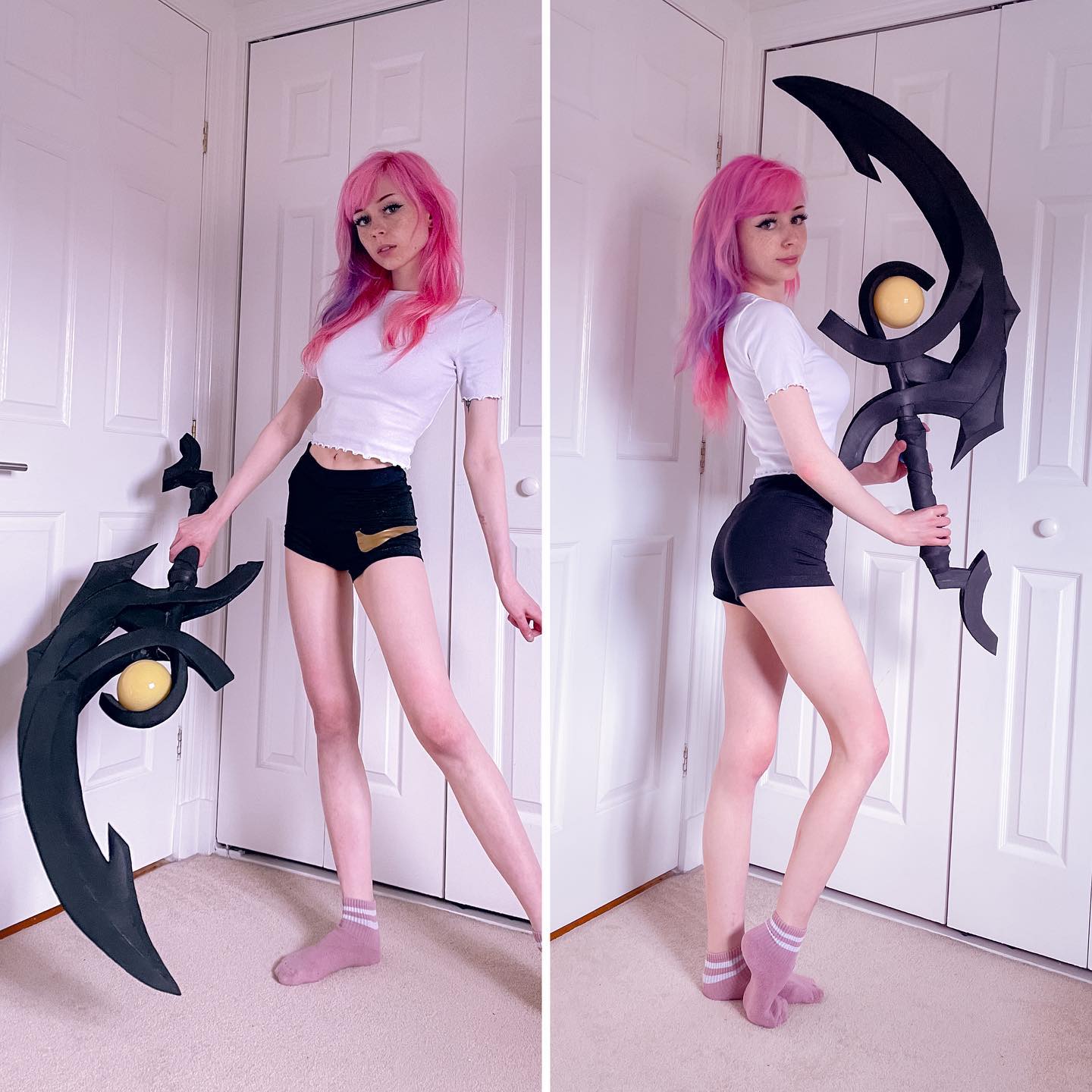 the image is a split photo showcasing a female cosplayer.  she has pink and purple hair, is wearing black shorts and a white shirt, and is posing with a large, intricately designed black scythe prop that looks like it might be from a video game, possibly league of legends.  the background is a simple whitewalled room with doors. the two halves of the image show the cosplayer from slightly different angles, emphasizing the prop and her pose. the overall style is bright and clean.