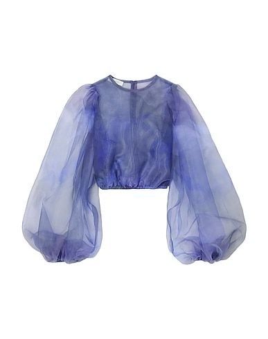 a blue, lavender colored, sheer organza crop top with puffed sleeves is shown.