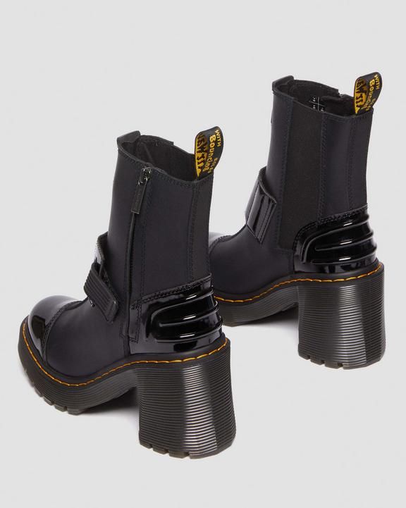 a pair of black leather boots with a chunky platform heel and ankle straps.