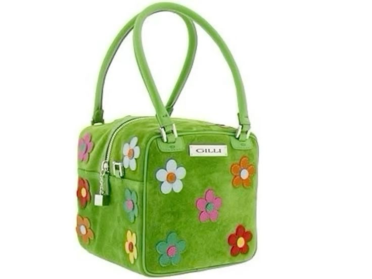 a green cubeshaped purse with floral appliques, dual handles, and a zipper closure. the brand name "gilli" is visible on a plaque.