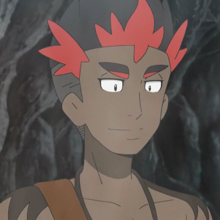 this is a closeup portrait of a male anime character. he has dark skin and red hair.  he is smiling and his hair is spiky. the background is dark and blurry, with some visible stone texture.  the character looks like a person in a video game or cartoon.