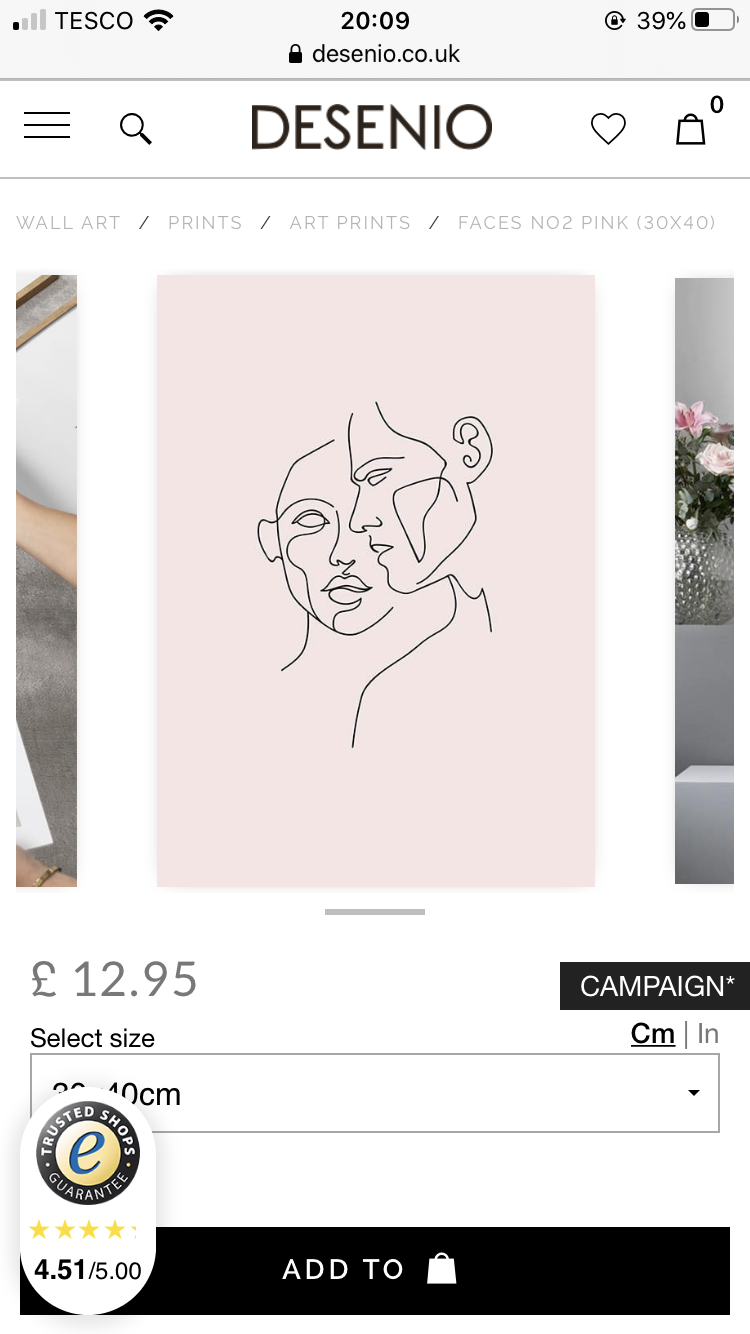 screenshot of a product page on the desenio website showing a minimalist line drawing of a woman's face in black on a dusty pink background. the print is titled "faces no2 pink (30x40)" and costs £12.95. there is a campaign running on the product. the image includes a trusted shops guarantee badge and a customer rating of 4.51/5.00. the website navigation bar at the top shows the website name, search bar, wishlist, and shopping bag icons. the breadcrumbs below indicate the product category: wall art / prints / art prints. there are also small preview images of other products on either side of the main image.