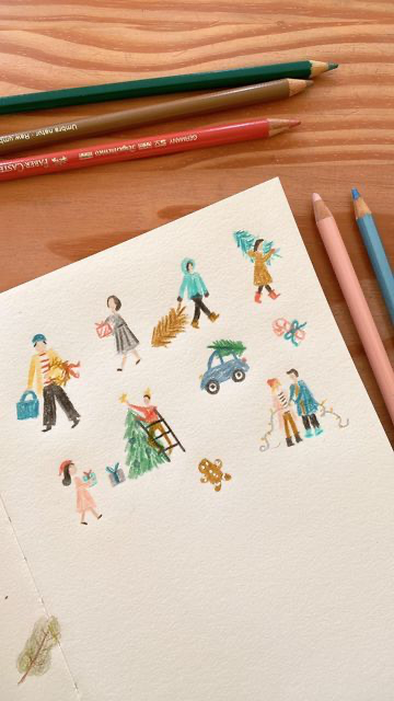 a drawing of a colorful, festive christmas scene with people, cars, and snow. the drawing appears to be done in color pencil on white paper. there is a collection of pencils in the image as well.