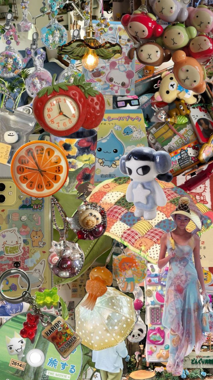 this image contains various items, including jewelry, a strawberryshaped clock, an orangeshaped clock, and various keychains (some featuring gummy bears and haribo goldbaren candies). there are also several toys present, including a doll with a star on its chest. a book and poster are also included in the image. a person is seen wearing a long blue dress. the image features a light fixture.
