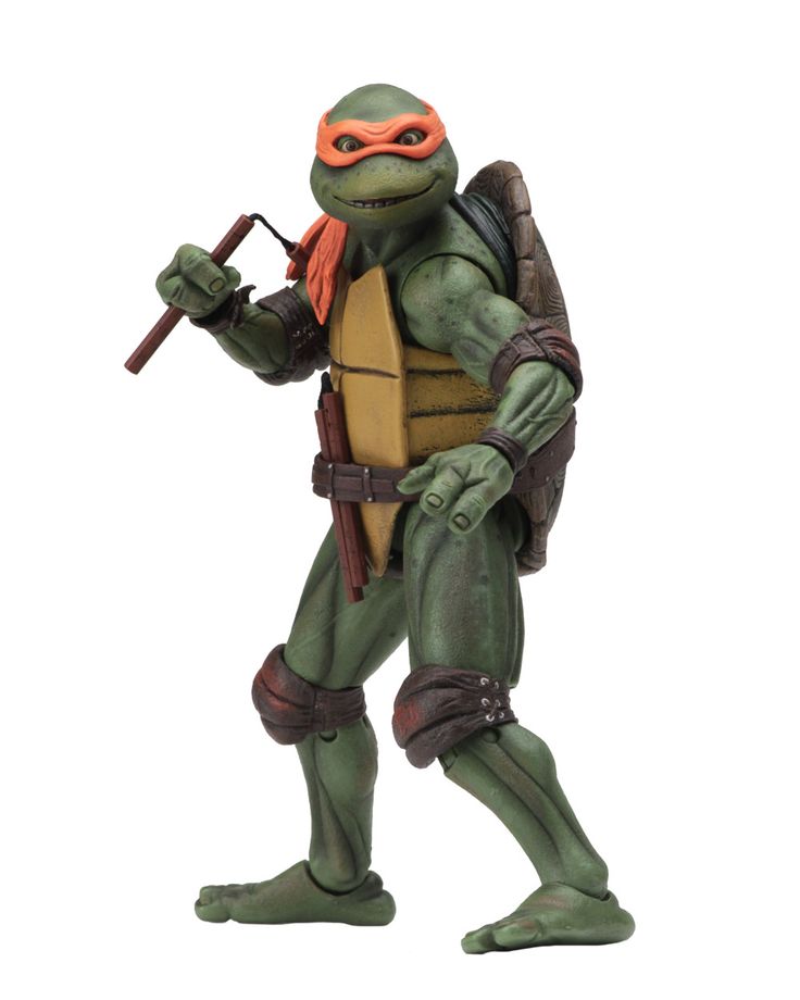 this is an action figure of michelangelo, one of the four teenage mutant ninja turtles. he is holding a sai in his right hand and has a nunchuck on his left. he has an orange bandana around his head.