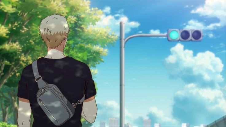 an anime character with blond hair wearing a black shirt and a crossbody bag is walking on a street with a green light. there are trees on the left side of the image and a blue sky with white clouds in the background.  the character is walking away from the viewer towards the streetlight with a green light.