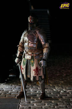 the image showcases a meticulously detailed action figure of a knight, possibly inspired by the dark souls video game series. the figure stands on a cobblestone street at night, bathed in dramatic lowkey lighting. the knight's armor is a mix of metal and leather, showing signs of wear, and his attire includes a flowing cloak adorned with fleurdelis emblems. he holds a sword, adding to the overall sense of a battleready warrior. the background is dark and indistinct, focusing all attention on the central figure. the word "epic" is subtly added in the upper right corner, further emphasizing the grandeur of the image. the overall aesthetic blends fantasy and historical elements, creating a striking visual.