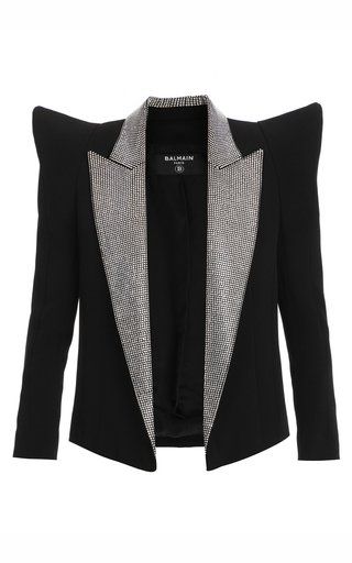 a black blazer with oversized shoulder pads and embellishments along the collar and lapels. the blazer is open and has no buttons. the brand is balmain.