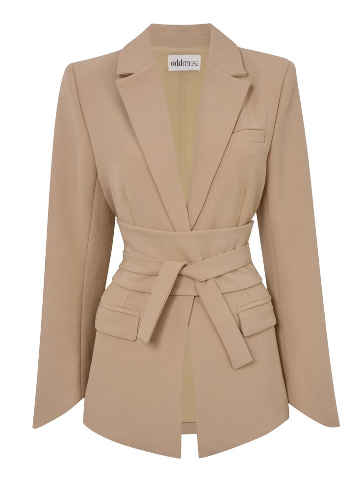 a beige odd muse blazer with a tie belt. the blazer has long sleeves, a lapel collar, a tie belt at the waist, and pockets on the lower part.