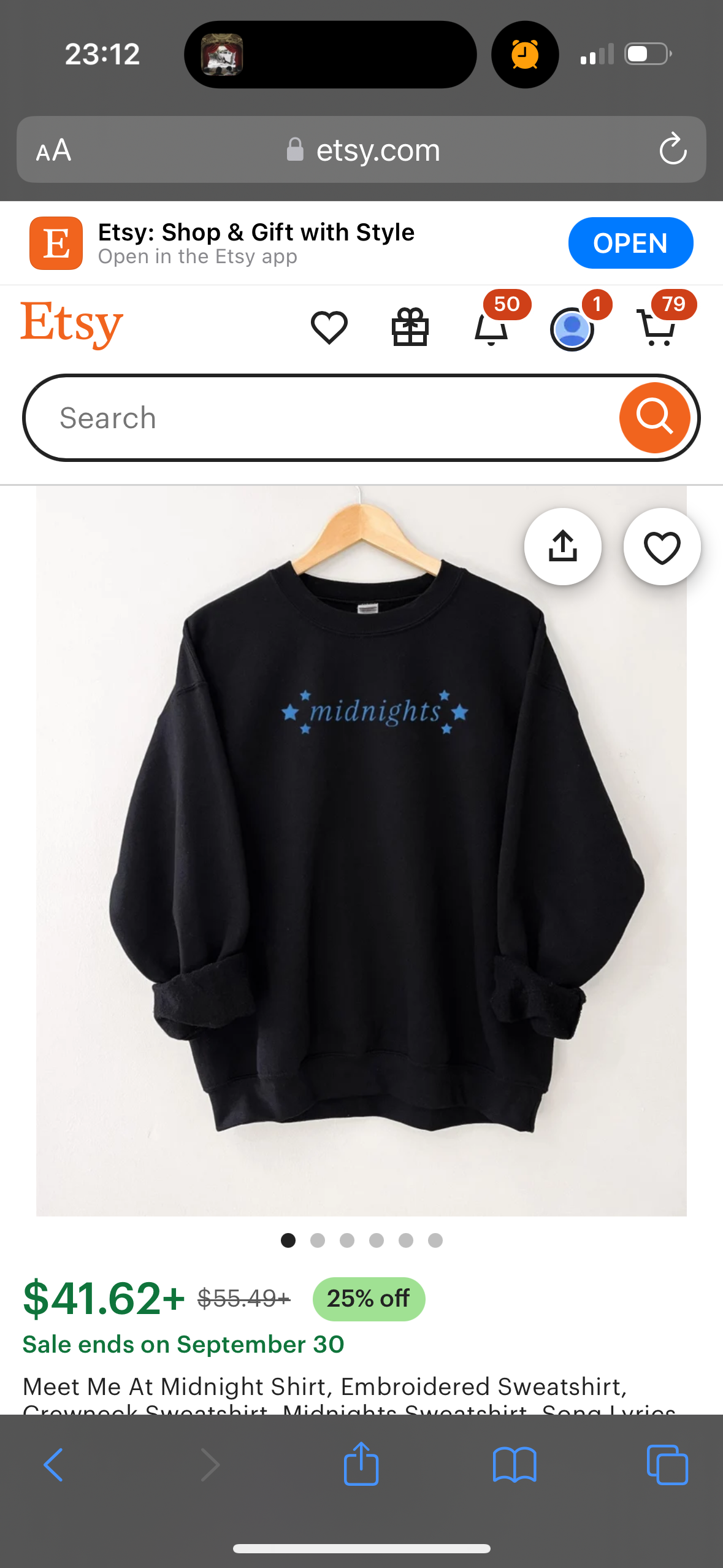 a black sweatshirt with a blue embroidered graphic that reads "midnights" with stars on either side. the text is in blue and the stars are small. the shirt is a crewneck sweatshirt and appears to be made of a soft fabric. it is being sold on the etsy app. the product name is "meet me at midnight shirt, embroidered sweatshirt". the price is $41.62. the sale ends on september 30.  the photo is taken on a white background with an image of a hanger in the top left corner. there are icons for sharing and adding to favorites in the top right corner.