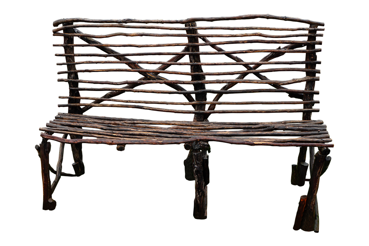 a rustic wooden bench, handcrafted from twigs and sticks, sits against a black background. the bench has a back and a seat, both made from horizontal sticks, with diagonal sticks providing support for the back. the legs are also made from sticks, giving the bench a natural and unfinished look.