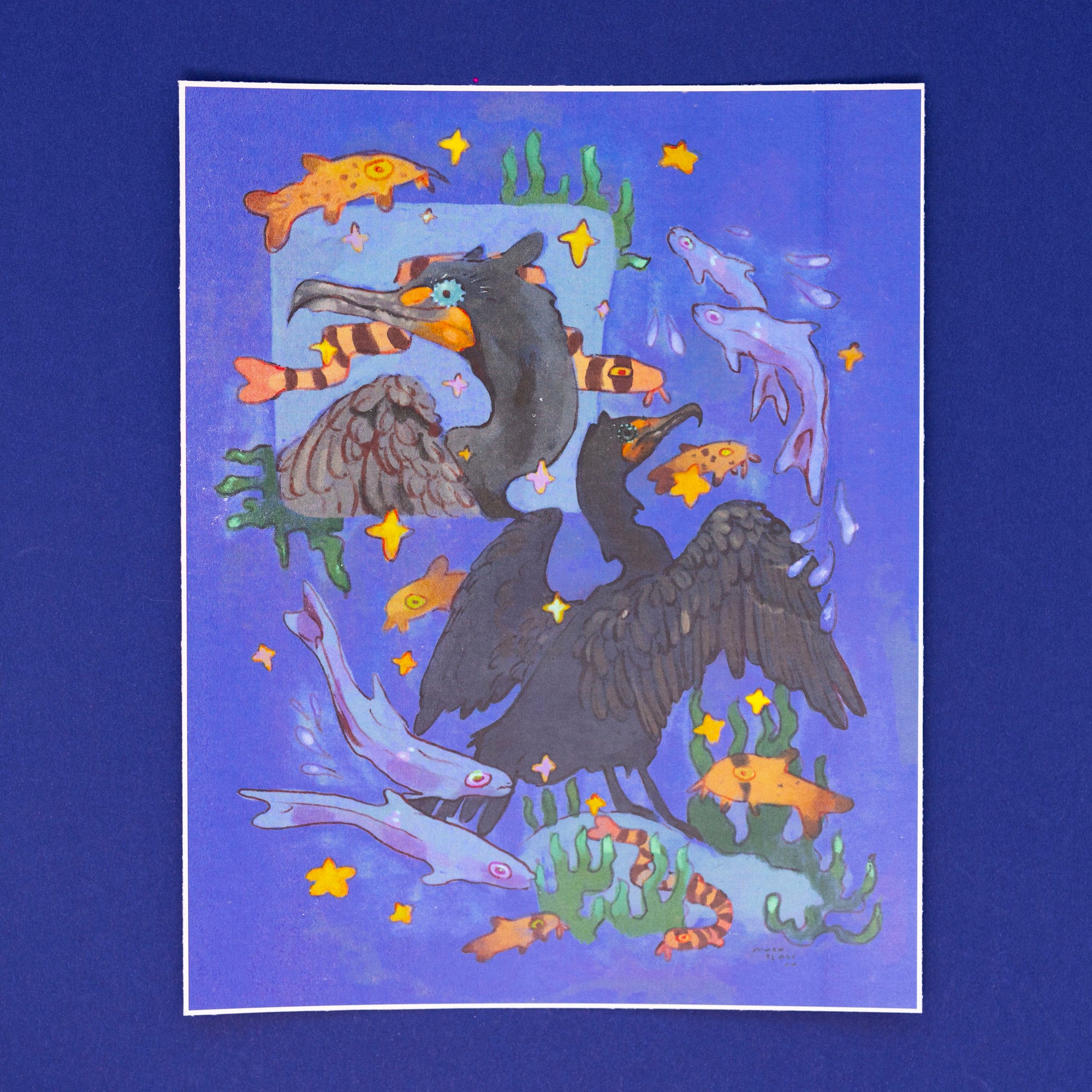 he image is a vibrant, whimsical illustration or painting of two cormorants amidst a lively underwater scene.  the background is a deep purple, dotted with gold stars. the cormorants are depicted in a stylized, almost cartoonish manner, with one appearing to wear a scarflike pattern.  surrounding the birds are various types of fish, seaweed, and other marine life, all rendered in a range of bold colors, including oranges, yellows, and blues. the overall style is playful and fantastical, suggesting a dreamy or surreal underwater world. the artwork is presented as a matted print.