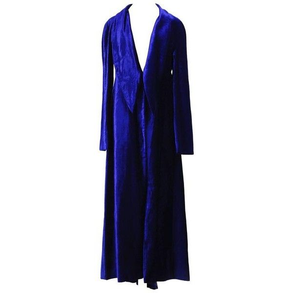 a long blue velvet robe with a large collar. the robe is longsleeved and has a deep vneck. the robe is perfect for a night in or a special occasion.