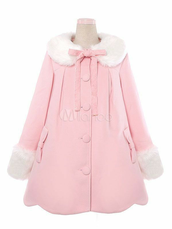 a pink winter coat with a big white fur collar, cuffs and bow at the neck is displayed on a mannequin. the coat has large white buttons and is in the lolita fashion style.