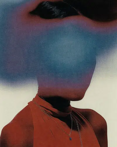 a woman in a red dress with a necklace, her face is mostly obscured by a blue shadow, she looks directly at the camera. the background is a light gray, with a slight gradient effect, and there is a slight blur effect on the image, giving it a dreamy, ethereal feel. the overall tone of the image is mysterious and alluring, with a sense of both power and vulnerability.
