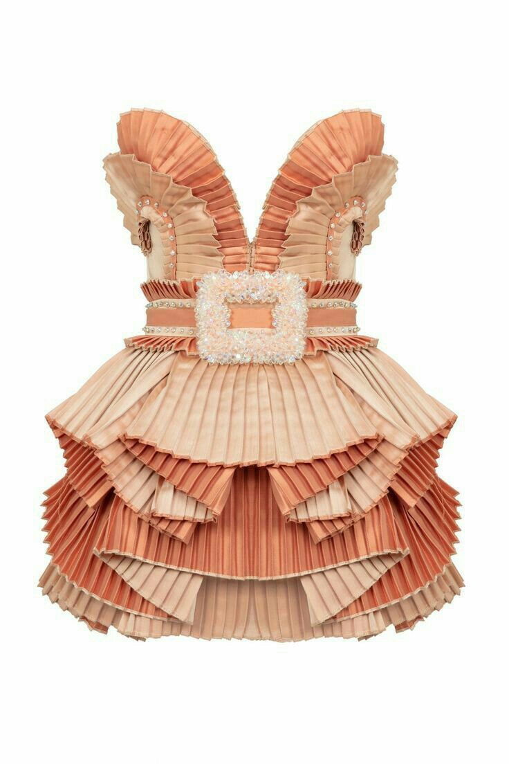 a sleeveless, peach and beige dress is displayed against a white background. the dress features a vneckline with ruffled edges, a belt with a large square buckle at the waist, and a tiered, pleated skirt with alternating peach and beige layers. embellishments are also visible around the neckline. the dress is crafted from fabric with a formal and decorative appearance.