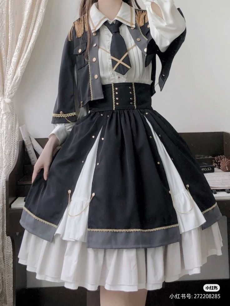 a young woman is wearing a black and white lolita fashion dress with militaryinspired details. she is posing indoors in a welllit room, and the image is taken from an eyelevel perspective.