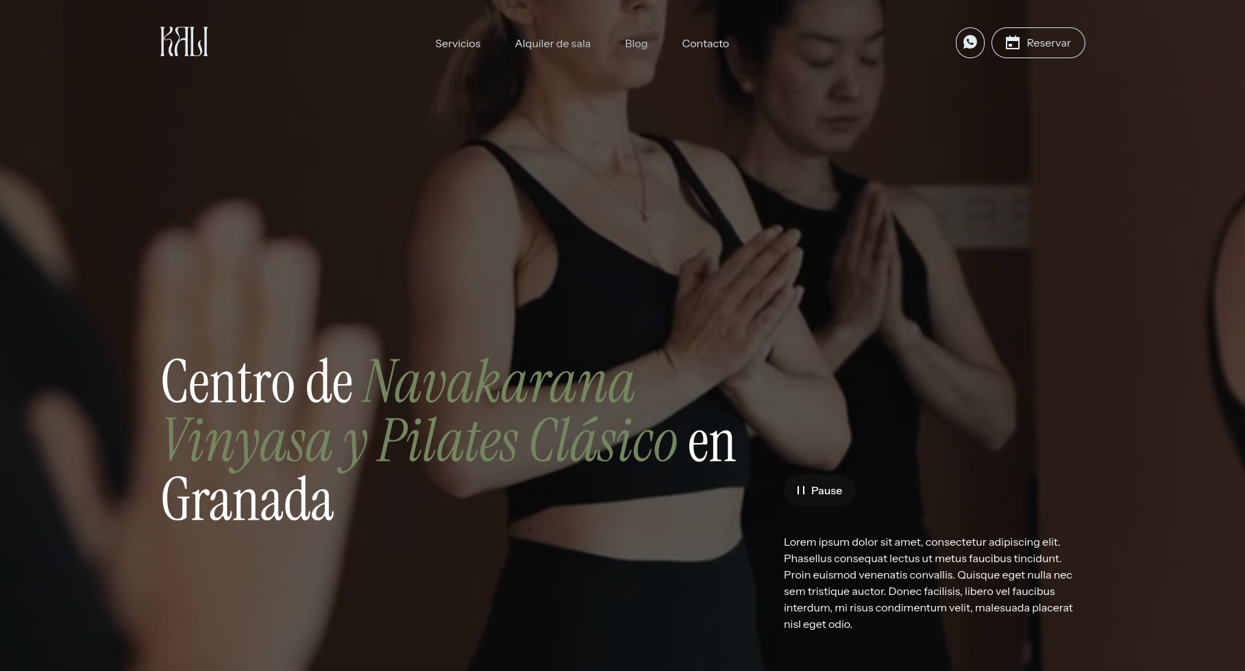 two women are shown in the image, one is in the foreground, the other in the background.  they are both dressed in black and are in a yoga pose.  the woman in the foreground has her hands in prayer position in front of her chest, while the woman in the background is holding her hands near her shoulders.  the background of the image is a dark brown wall, with a white light to the left and right of the two women.  there is a reflection of the women on the wall, with text that reads, "centro de navakarana vinyasa y pilates clásico en granada".  the text is in a light green font, and the image is framed with text that reads, "kali", "servicios", "alquiler de sala", "blog", "contacto", and "reservar". the text is in a white font and is located at the top of the image.  the background text in the image is a description of the business, and the image is a website advertisement for a yoga and pilates studio in granada, spain.