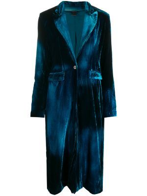 a long, teal velvet coat with notched lapels and long sleeves. it has a single button closure and two small pockets on the front.