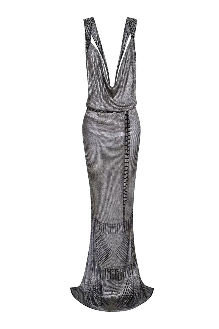 a full shot of a silver, sleeveless, cowl neck evening gown with a geometric pattern.