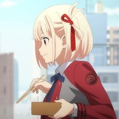 the image shows a young anime girl with short blonde hair and red eyes, tied with a red ribbon. she is wearing a school uniform and enjoying her lunch outdoors. she holds chopsticks in her right hand and a lunchbox in her left, a gentle smile gracing her face. the background suggests an urban setting, possibly a school rooftop or street. the colors are soft and warm, creating a pleasant and inviting atmosphere.