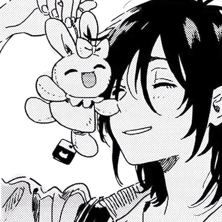 the image is a black and white closeup drawing of a young anime/manga girl. she has long, dark hair and is smiling happily while holding a cute bunnyshaped plush keychain. her expression is cheerful and playful. the style is typical of manga art.