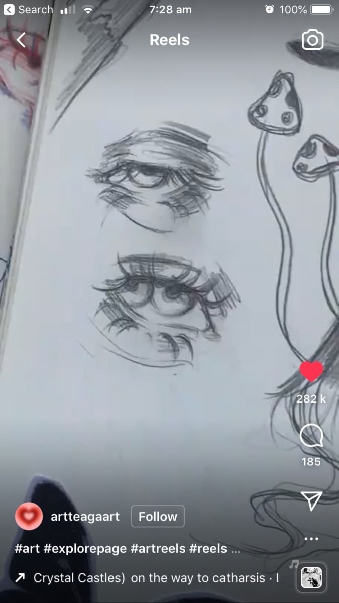he image shows a closeup of a sketchbook page featuring two detailed pencil sketches of eyes. the eyes are rendered with varying levels of shading and detail, showcasing a range of emotions and expressions. there are also two mushroom sketches on the right of the page, along with a caption including hashtags and a username of the artist "artteagaart". the image is an instagram reel post.