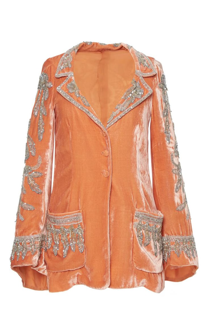 an orange velvet jacket with beaded embellishments is pictured. the jacket has a lapel collar, two pockets decorated with dangling beads, and long sleeves with beaded patterns. it appears to have two buttons.