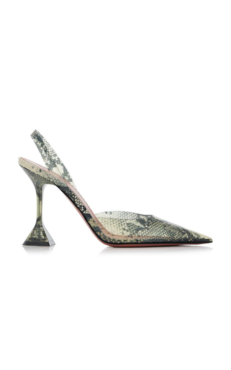 the image showcases a single women's highheeled slingback shoe. the shoe features a pointed toe, a transparent upper showcasing a snakeskin print underneath, and a distinctive, sculptural heel with a pyramidlike base. the overall style is elegant and modern. the color palette is muted, with the snakeskin print in shades of beige and grey.  the shoe appears to be made of highquality materials.  the image is set against a plain white background, drawing focus to the shoe's unique design.