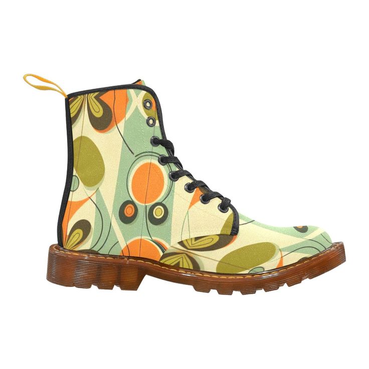 a pair of retroinspired boots with an abstract geometric pattern in green, orange, and yellow. the boots have black laces and a brown sole.