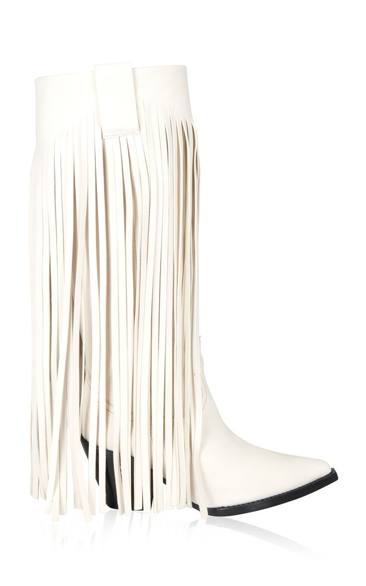a pair of elegant white women's cowboy boots with long fringes is showcased against a clean white background. the boots are made of creamcolored leather, and the fringes extend from the top of the boot down to the bottom, covering most of the boot's shaft. the boots have a pointed toe and a slightly heeled bottom. the image is welllit and shows the boots clearly. the boots appear to be made of a soft, supple leather.  the overall style is feminine and fashionable with a western flair.