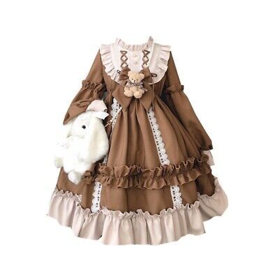 this is a photograph of a brown lolita fashion dress. the dress is made of a brown fabric with lace and frill details. it features a white lace collar and cuffs, and a brown bow at the waist. there is a small teddy bear attached to the bow. the skirt of the dress is full and has multiple layers of frills. the dress is shown on a mannequin against a plain white background. a white stuffed bunny is tucked in the pocket of the dress.