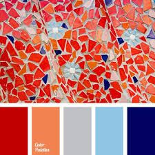a close up of a red, blue, and orange mosaic tile wall. there are five color blocks beneath the mosaic showing the dominant colors in the image, the color blocks are from left to right: red, orange, light gray, light blue, dark blue.