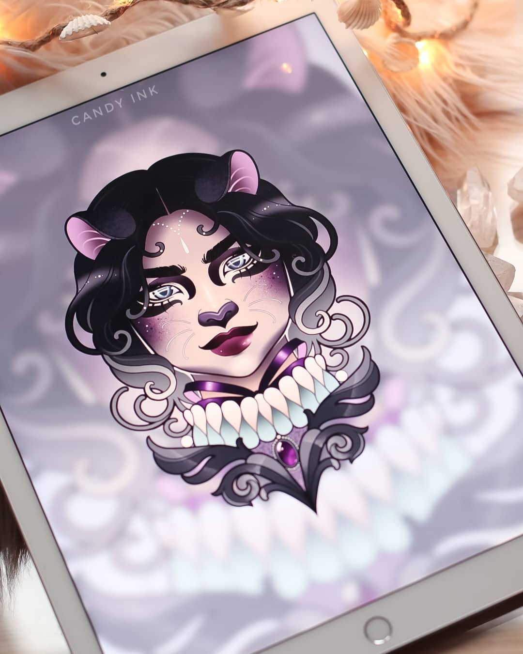 this is a digital drawing of a female character with feline features, such as cat ears, a cat nose, and catlike eyes. she has long, flowing black and white hair, pale skin, and striking blue eyes. she is wearing an elaborate purple and white collar adorned with a large purple gem. the drawing has a soft, dreamy quality, and the colors are predominantly shades of purple, black, and white. the artwork is signed "candy ink" in the top left corner and appears to be displayed on a tablet.