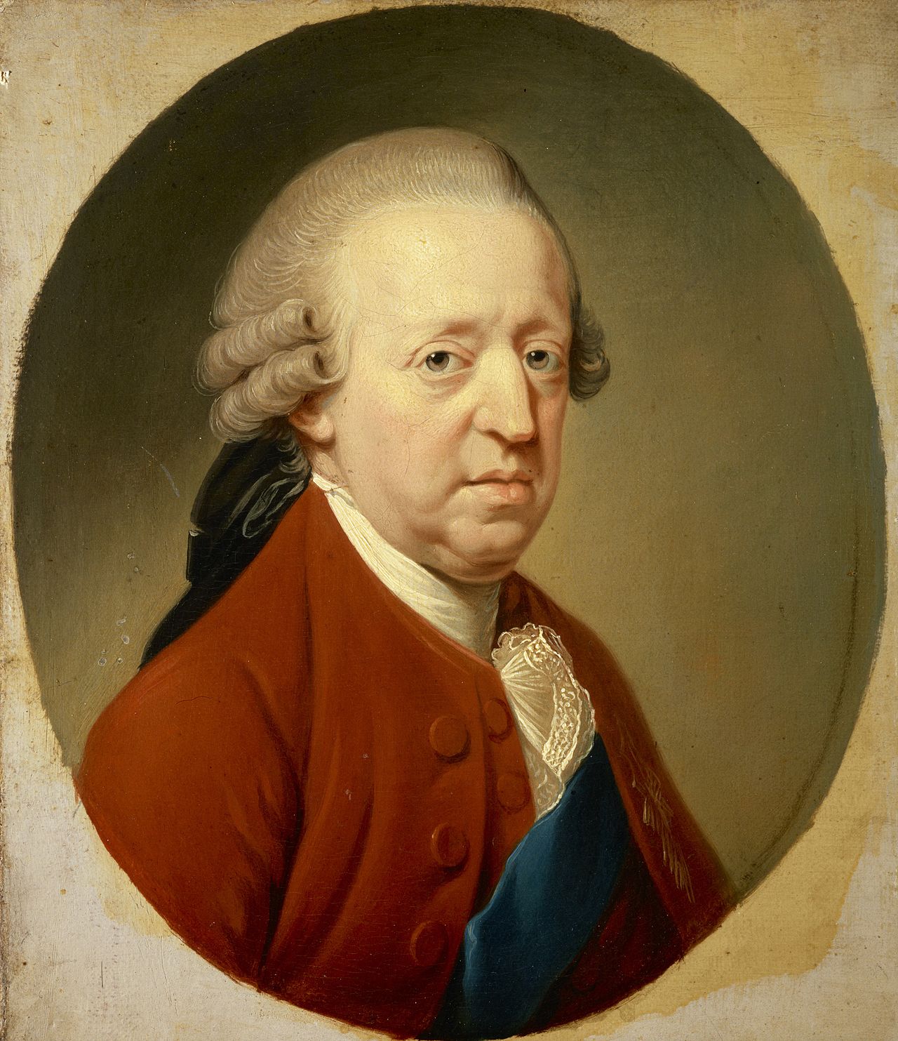 this is a portrait painting of a man, identified as george iii, set within an oval frame. the man is depicted from the chest up and is dressed in formal attire typical of the georgian era. he sports a white, powdered wig and wears a red coat with gold buttons. a delicate lace cravat adorns his neck, and a blue sash is draped across his chest. the painting showcases the style and fashion of the aristocracy during the time period. the man's facial expression is neutral, and the artwork conveys a sense of formality and status. the medium appears to be oil on canvas, suggesting a fine art piece likely commissioned to commemorate the individual's importance.