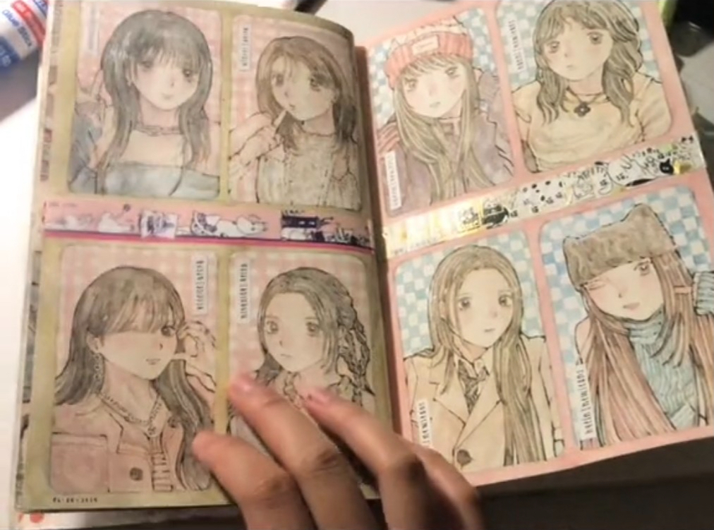 this image shows a sketchbook with multiple drawings of anime girls. the girls are drawn in a variety of styles and are wearing different outfits. the drawings are well done and are filled with vibrant colors. the sketchbook is open to a page that features five different drawings of anime girls.  the page is covered in intricate doodles. the girl's faces are beautiful with soft lips and eyes. the overall look of the drawings is realistic and detailed. the drawings are a testament to the artist's skills.  a hand appears in the foreground, flipping the pages of the book.