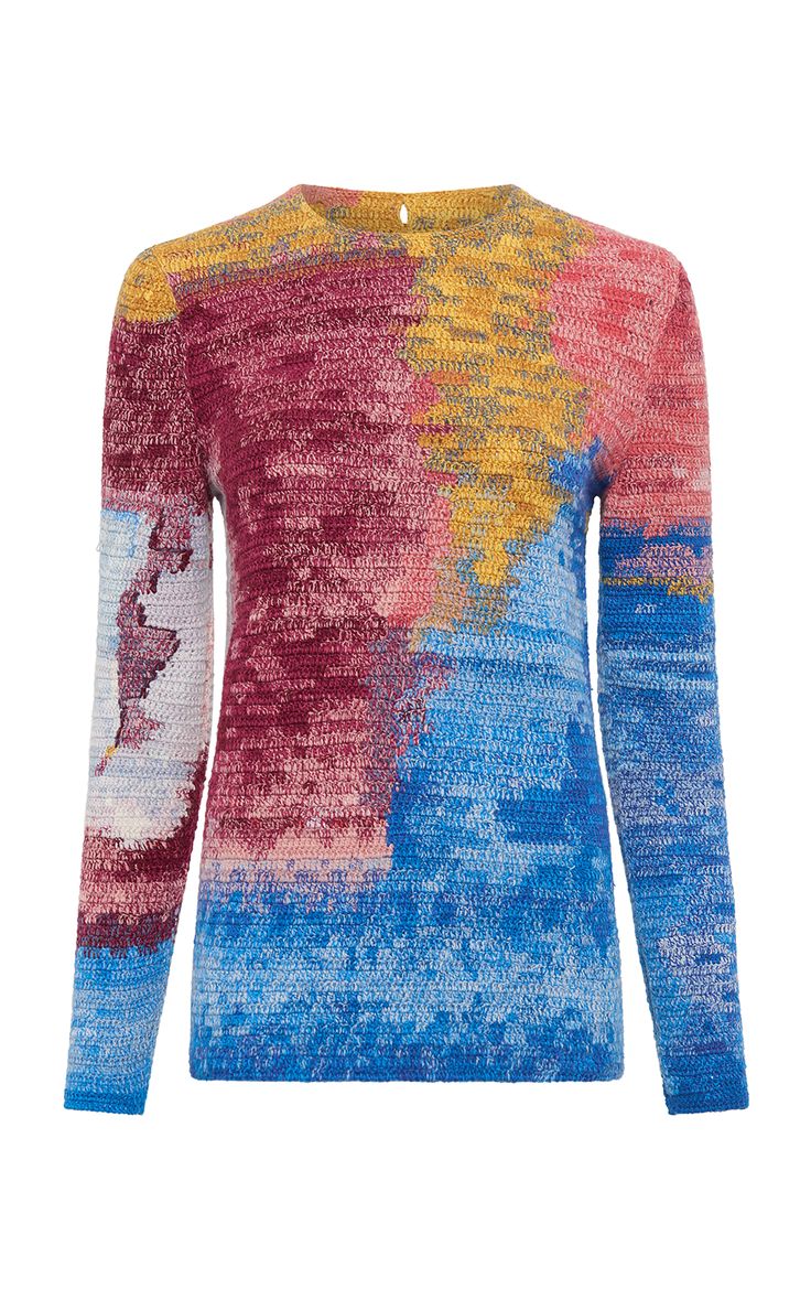 a longsleeved, abstract pattern sweater with a colorful knit, the colors of the knit are pink, yellow, and blue. the sweater has a loose, casual fit. the sweater is trendy and contemporary, with a unique and eyecatching design. this sweater is perfect for any woman looking for a stylish and comfortable piece of clothing.