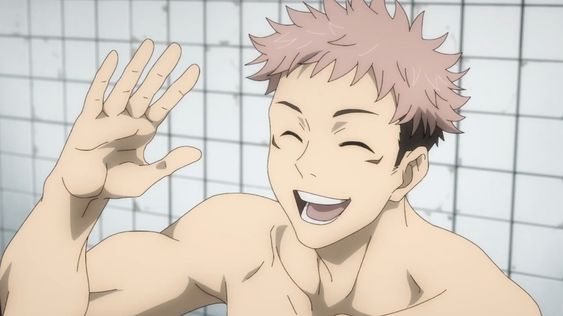 this is a selfie of yuji itadori from jujutsu kaisen. he is shirtless, showing off his muscular physique and smiling brightly. he has spiky pink hair and is standing in what appears to be a bathroom or shower room. the room is brightly lit with an overall warm tone.