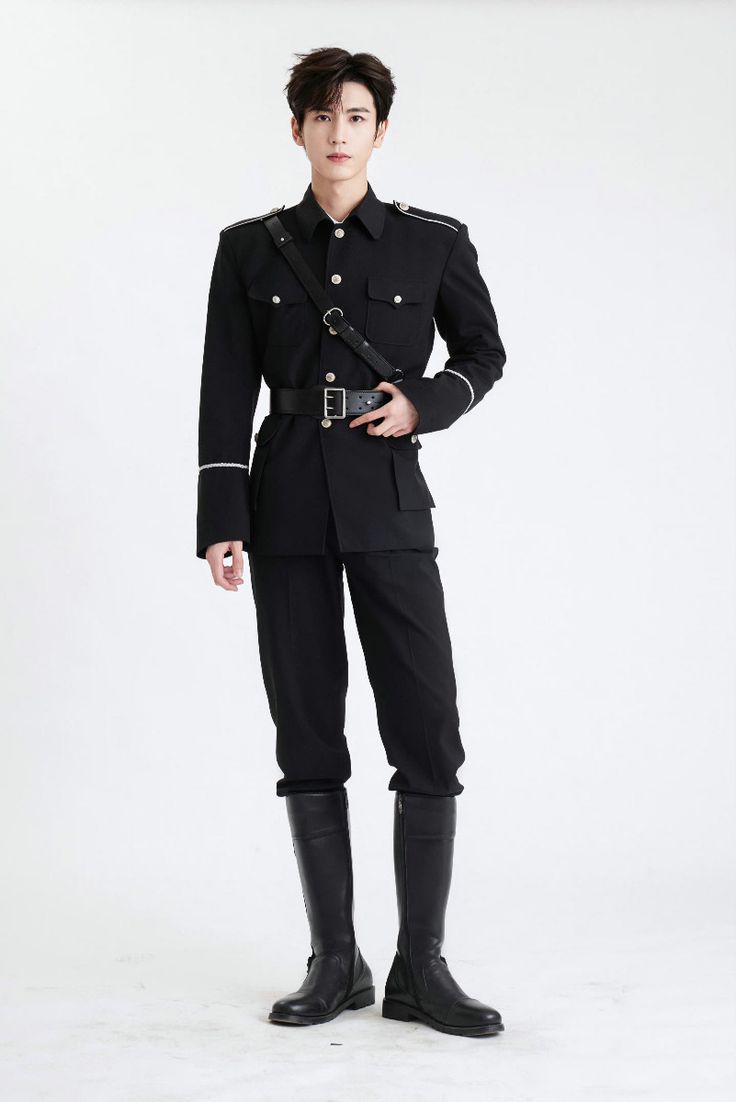 a fullbody shot of a young asian man in a black militarystyle uniform. he's standing against a plain white background, looking directly at the camera.  his attire includes a longsleeved jacket with epaulets, black trousers, a black belt, and tall black boots. the overall look is sharp and stylish.