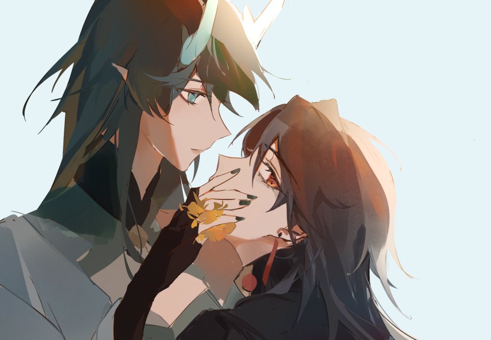 the image is an anime style illustration of a male and female couple with long black hair. the male has blue eyes and a