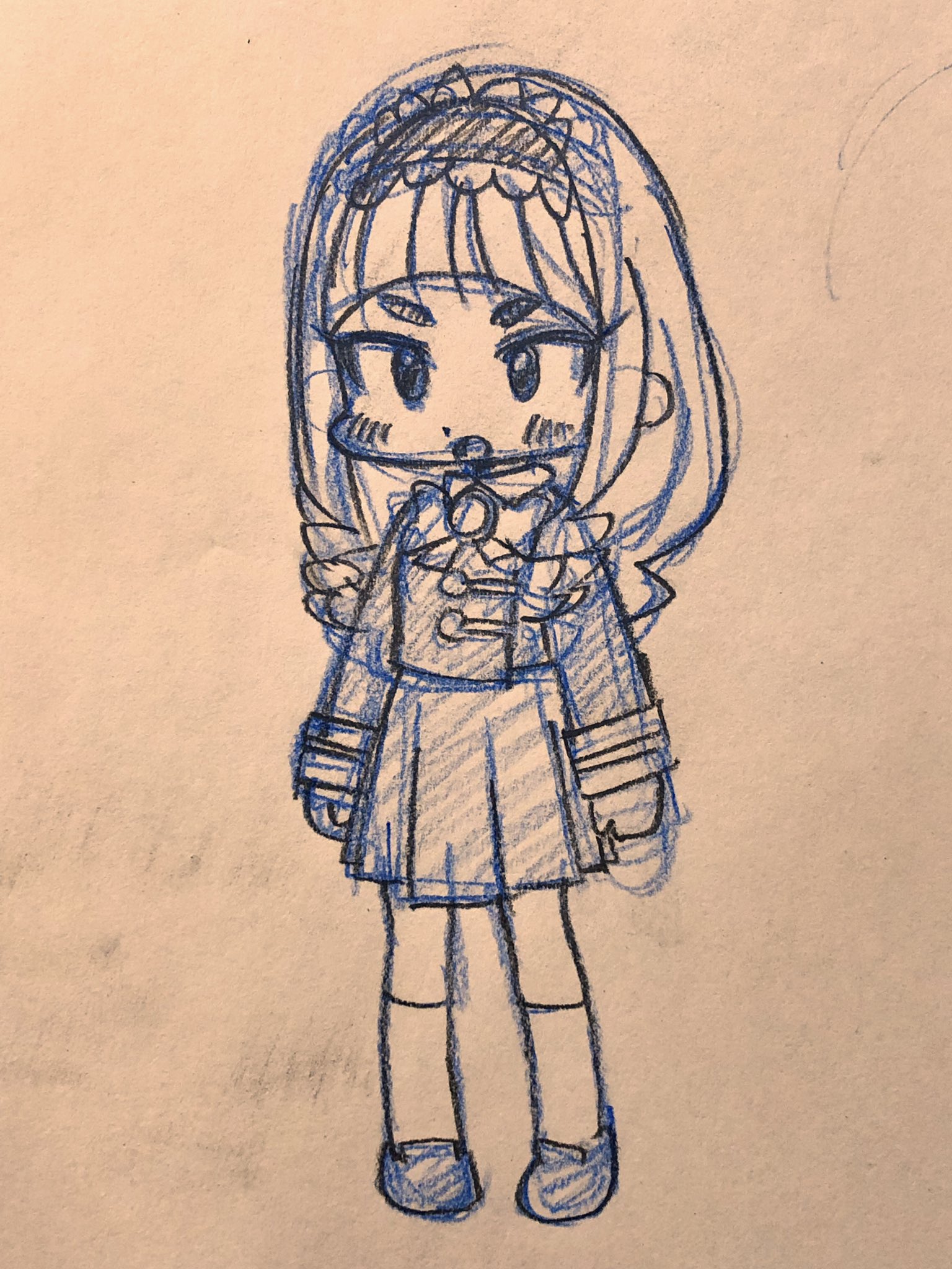 this is a simple blue pen sketch of a girl on a tan piece of paper. she appears to be wearing a lolitastyle dress. the character's details are drawn with thin lines to suggest a smaller stature.