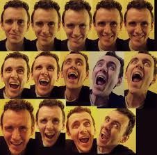 the image is a collage of faces, all appearing to be the same man, showing a range of emotions and expressions. the faces progress from smiling to increasingly exaggerated and intense displays of emotion, including laughter, shock, and screaming. the arrangement of the faces is in a gridlike pattern.